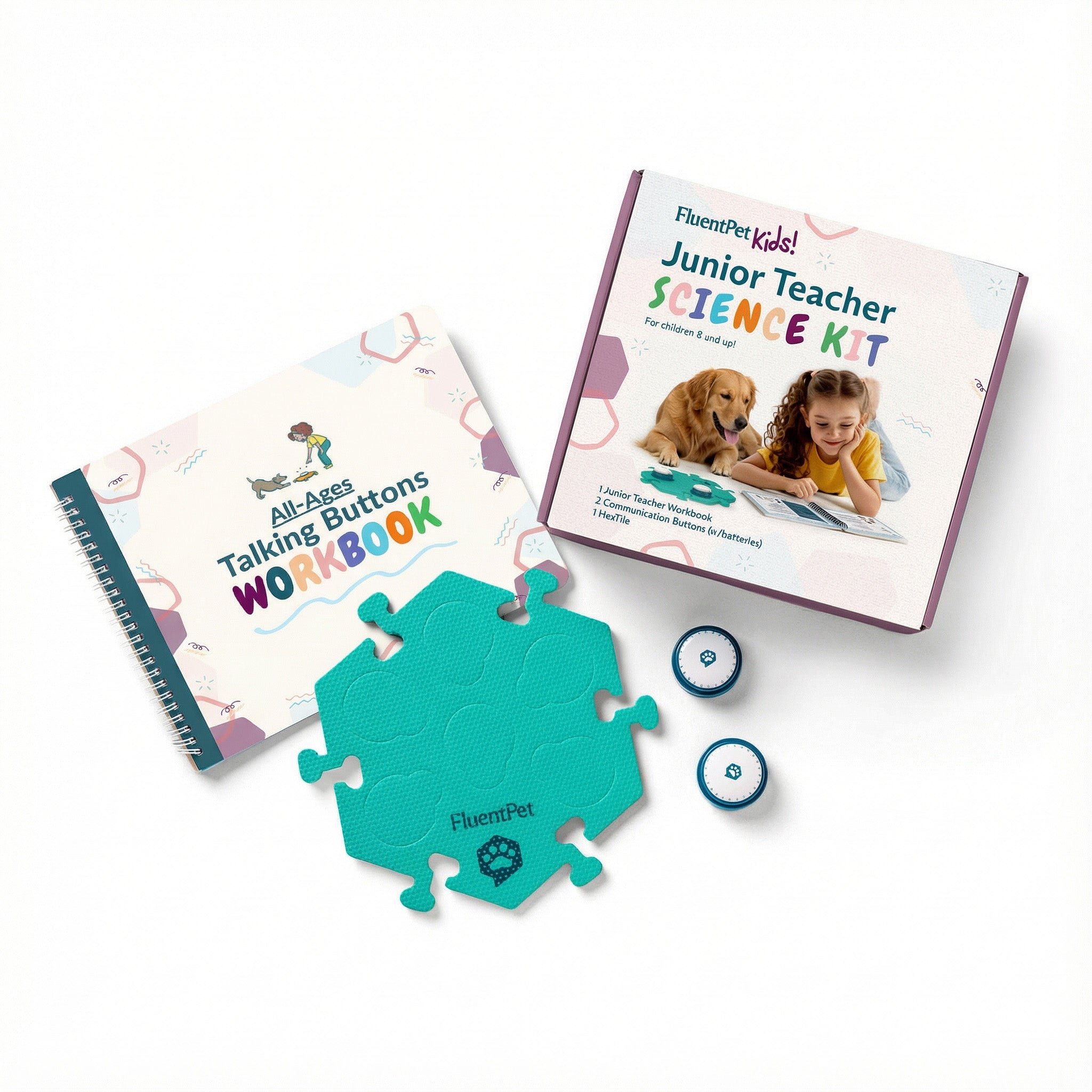 The FluentPet Junior Teacher Science Kit featuring a box, a green HexTile, two Speak Up! recordable buttons and the Junior Teacher Workbook.