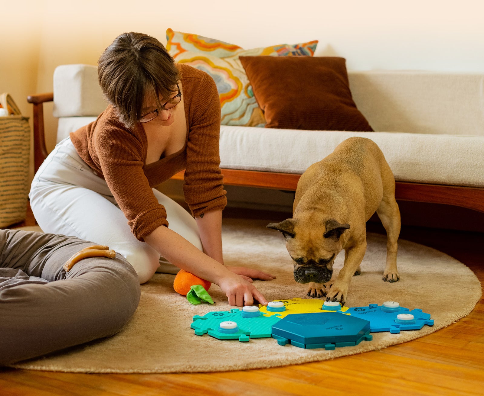 Women and her dog communicating using the FluentPet Connect HexTile and Buttons