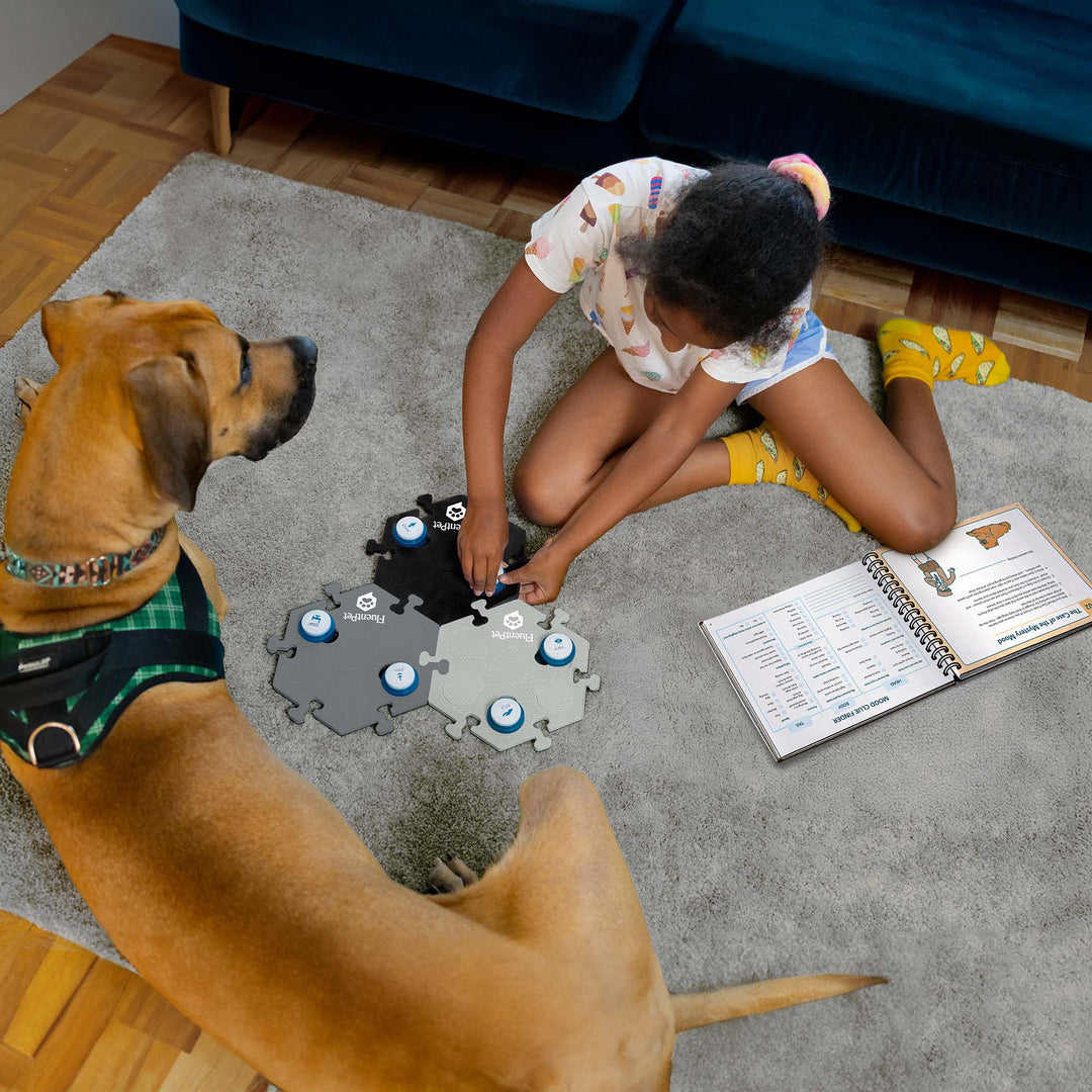 Young Girl teaching her dog using the Junior Teacher Starting Kit